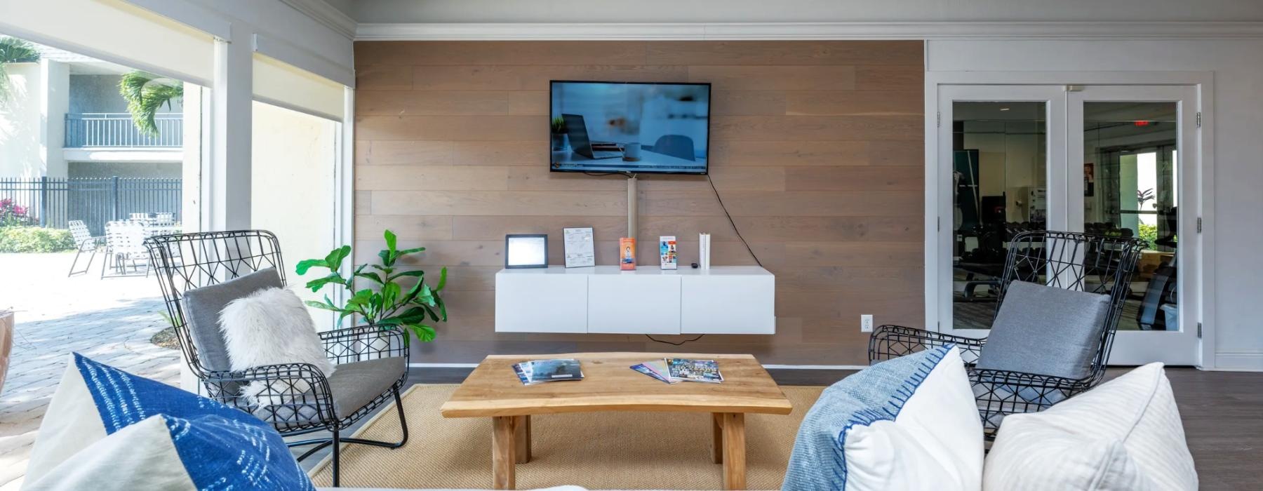 a living room with a tv and couches